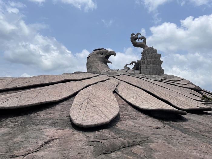 Side view of the Jatayu Earth Sculpture against the scenic backdrop of Kerala’s landscape